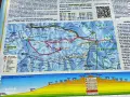 Mapa z zaznaczonymi gorce szlaki turystyczne, w tym trasy narciarskie i piesze. Widoczne szczyty, schroniska i punkty widokowe.
