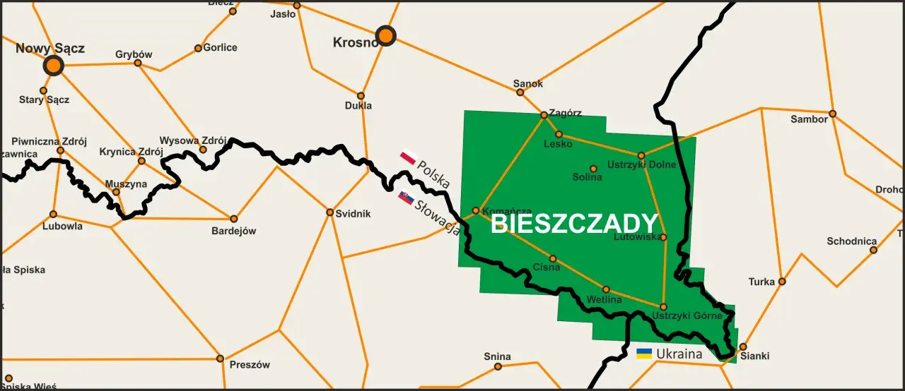Mapa pokazuje, gdzie leżą Bieszczady, zaznaczone zielonym obszarem między Polską, Słowacją i Ukrainą, z widocznymi miastami jak Sanok, Lesko i Ustrzyki Dolne.