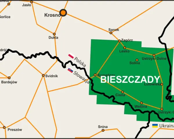 Mapa pokazuje, gdzie leżą Bieszczady, zaznaczone zielonym obszarem między Polską, Słowacją i Ukrainą, z widocznymi miastami jak Sanok, Lesko i Ustrzyki Dolne.
